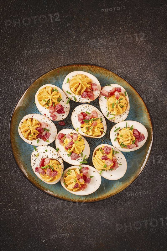 Spicy, stuffed ramen eggs, with bacon and green onions, homemade, no people