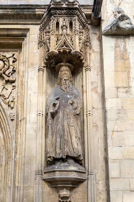 Carved stonework statue of Saint Paul, front of Abbey church, city of Bath, north east Somerset, England, UK