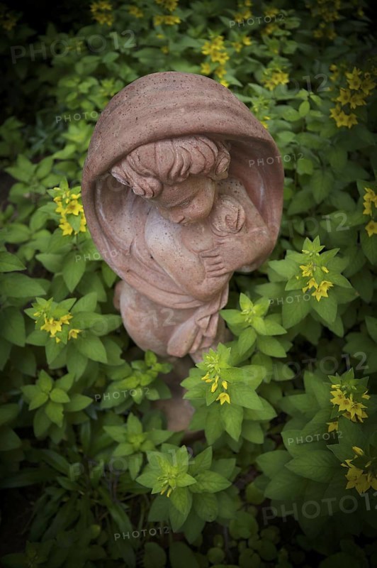 Terracotta statue, girl, between spotted loosestrife (Lysimachia punctata), also known as spotted loosestrife, garden, Stuttgart, Baden-Württemberg, Germany