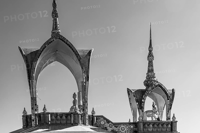 Round arch pavilions decorated with mosaics and glass works of art, black and white photo, Buddhist temple complex Wat Phra That Sorn Kaew, Phetchabun province, Thailand
