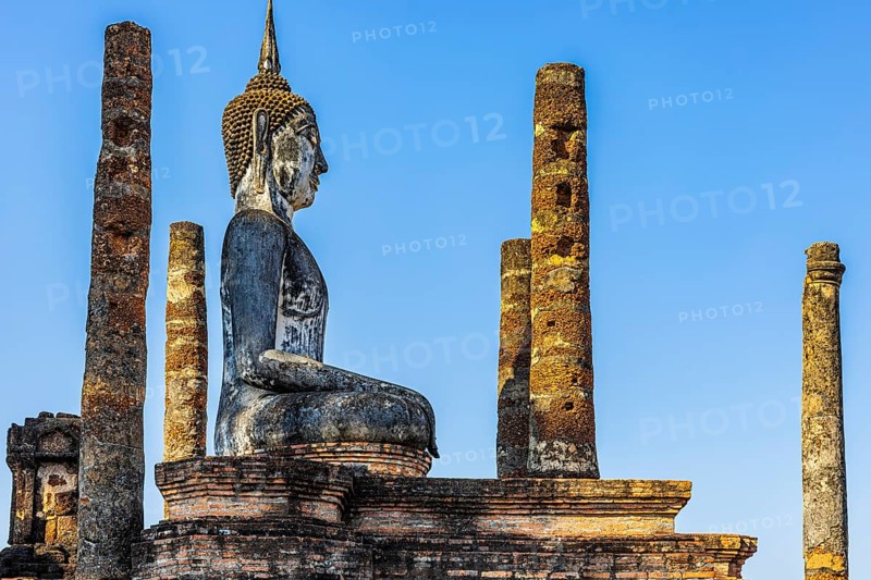 Stone Buddha statue in the historic Wat Mahathat Buddhist temple complex, historical park, Sukhothai, Sukhothai province, Thailand