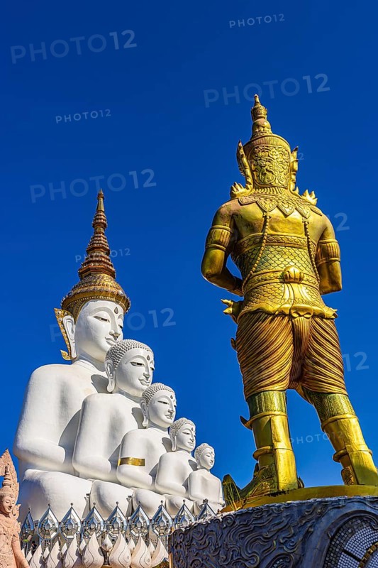 Five-headed Buddha statue with a gilded temple guard in front of it, Wat Phra That Sorn Kaew Buddhist temple complex, Phetchabun province, Thailand