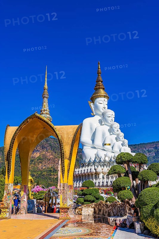 Round arch pavilion decorated with colorful mosaics and glass works of art, the five-headed Buddha statue at the back, Wat Phra That Sorn Kaew Buddhist temple complex, Phetchabun province, Thailand