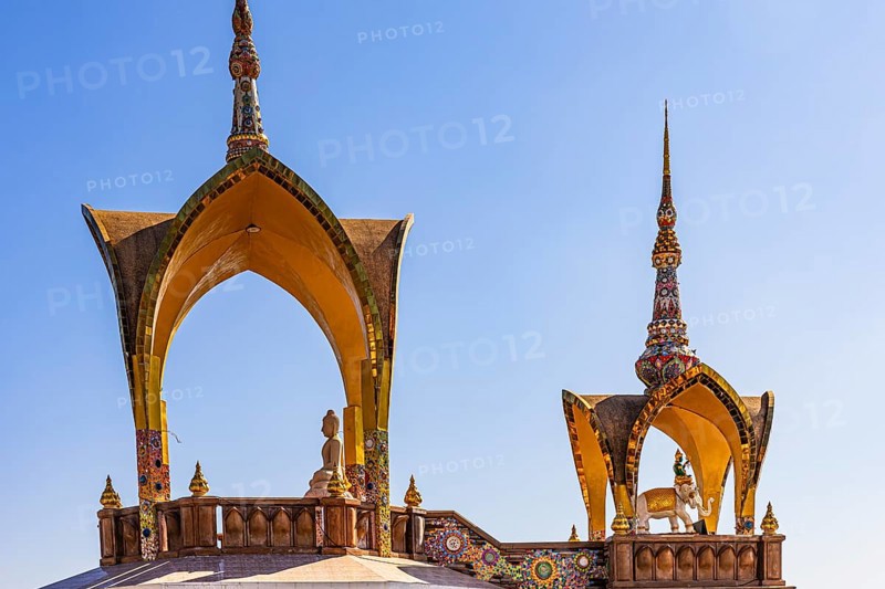 Round arch pavilions decorated with colorful mosaics and glass works of art, Buddhist temple complex Wat Phra That Sorn Kaew, Phetchabun province, Thailand