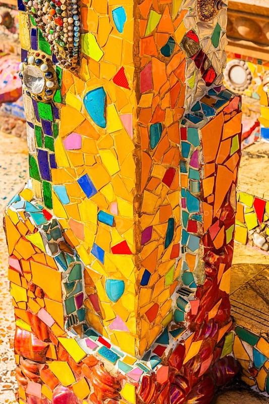 Column decorated with colorful mosaics, Buddhist temple complex Wat Phra That Sorn Kaew, Phetchabun province, Thailand