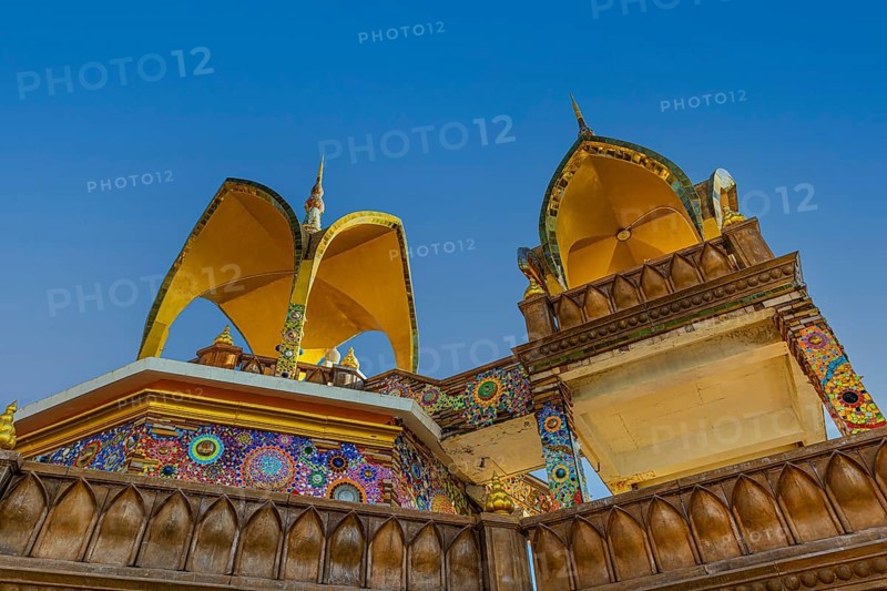 Round arch pavilions decorated with colorful mosaics and glass works of art, Buddhist temple complex Wat Phra That Sorn Kaew, Phetchabun province, Thailand