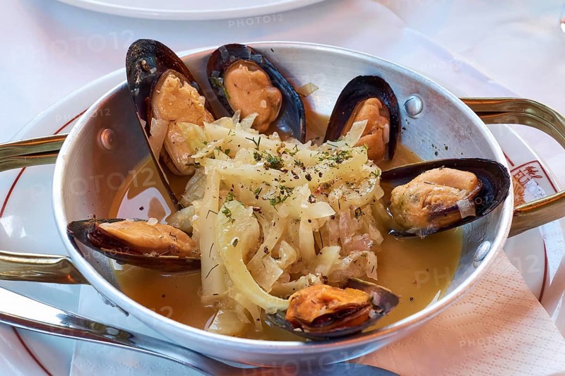 Tasty seafood platter with mussels and aromatic herbs in an elegant restaurant, Hotel Europa, garden restaurant and views of the surrounding countryside, Olympia, Peloponnese, Greece