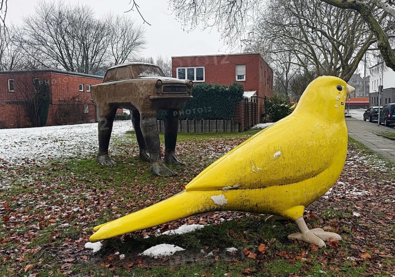 Very large yellow canary and trobant sculpture by David Cerny' at the Holy Spirit Church, Kunstraum Heilig Geist, Essen, Ruhr region, Germany