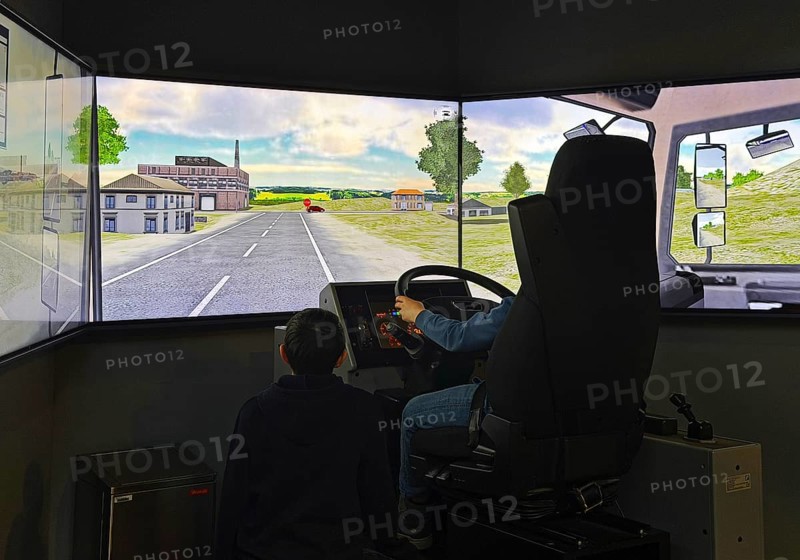Truck simulator with children at DASA, German Occupational Safety Exhibition, Dortmund, Ruhr area, North Rhine-Westphalia, Germany