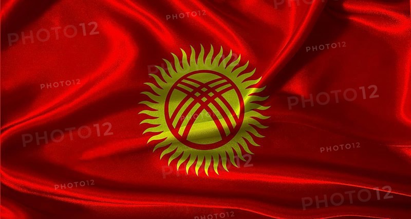 Kyrgyzstan flag with cloth textured background. National flag of Kyrgyzstan with realistic texture
