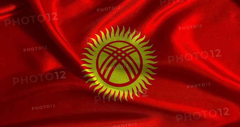 National flag of Kyrgyzstan with cloth texture. Kyrgyz flag with realistic texture background