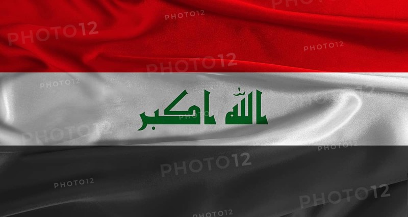 Flag of Irak with fabric textured background. Close up of National flag of Irak with realistic texture