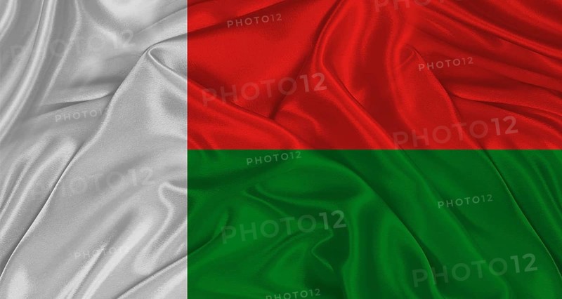 Malagasy flag with fabric texture. Realistic flag of Madagascar waving, National flag