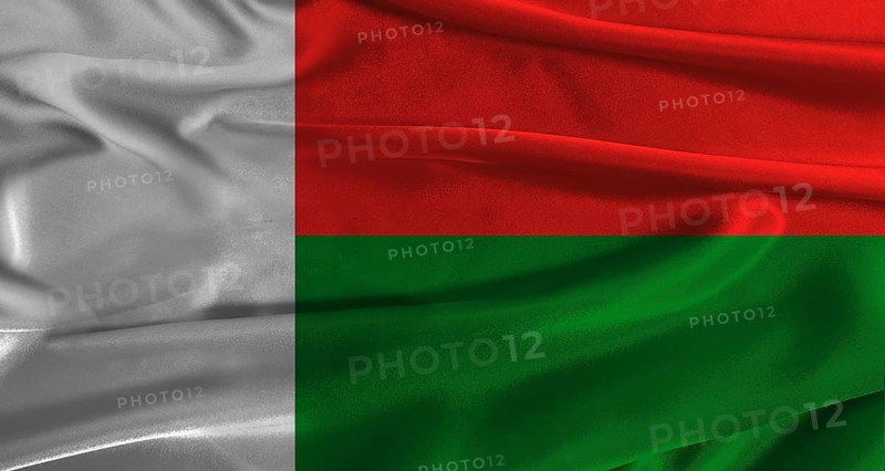 Flag of Madagascar with fabric textured background. Close up of National flag of Madagascar with realistic texture