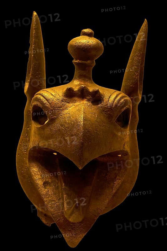 Bronze griffin protome, golden sculpture of a mystical animal head with detailed features, Olympia Archaeological Museum, Ancient Olympia, Olympia, Peloponnese, Greece