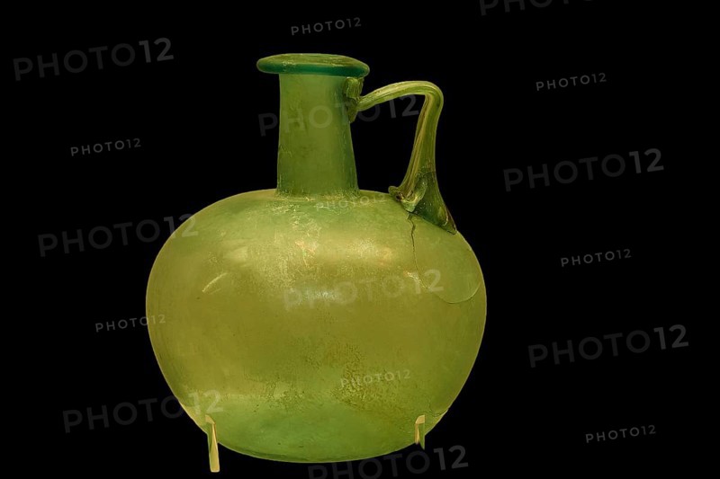 Ancient green glass vase with round body and narrow handle, Olympia Archaeological Museum, Ancient Olympia, Peloponnese, Greece