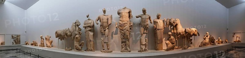 East pediment of the Temple of Zeus, preparations for the chariot race between Pelops and Oinomaos, panoramic view of ancient statues in a museum setting, Olympia Archaeological Museum, Ancient Olympia, Olympia, Peloponnese, Greece