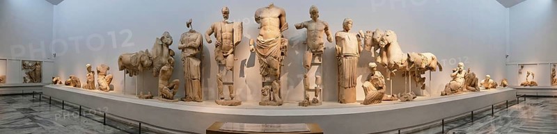 East pediment of the Temple of Zeus, preparations for the chariot race between Pelops and Oinomaos, panoramic view of an exhibition of ancient sculptures in a museum, Olympia Archaeological Museum, Ancient Olympia, Olympia, Peloponnese, Greece