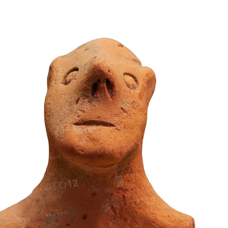 Anthropomorphic votive statuette, clay figure with abstract animal form, simple design and earthy colors, Olympia Archaeological Museum, Ancient Olympia, Olympia, Peloponnese, Greece