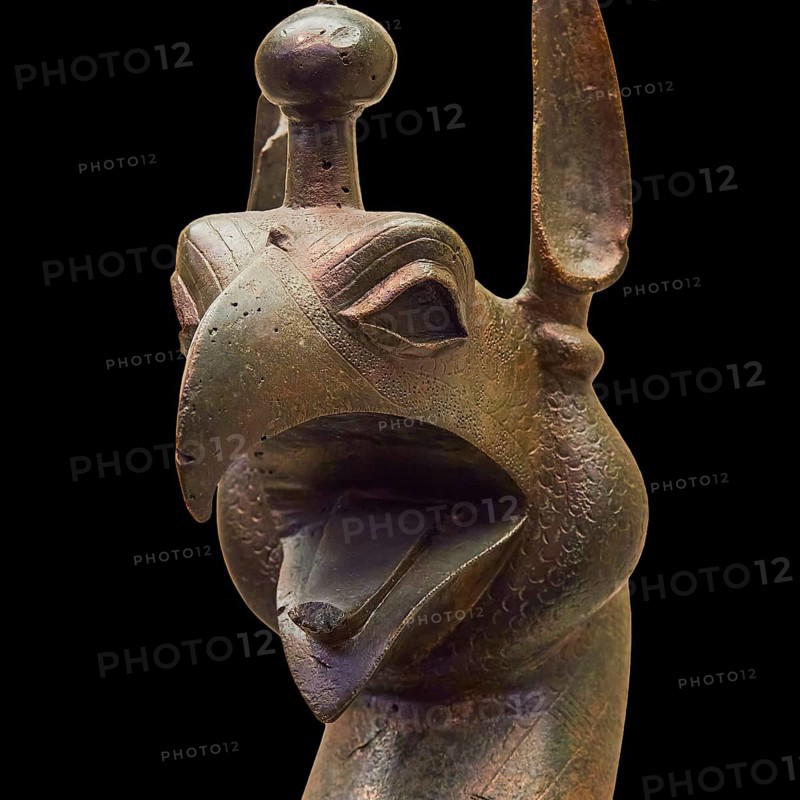 Bronze griffin protome, bronze sculptural depiction of a mythical being with stylized head, Olympia Archaeological Museum, Ancient Olympia, Olympia, Peloponnese, Greece