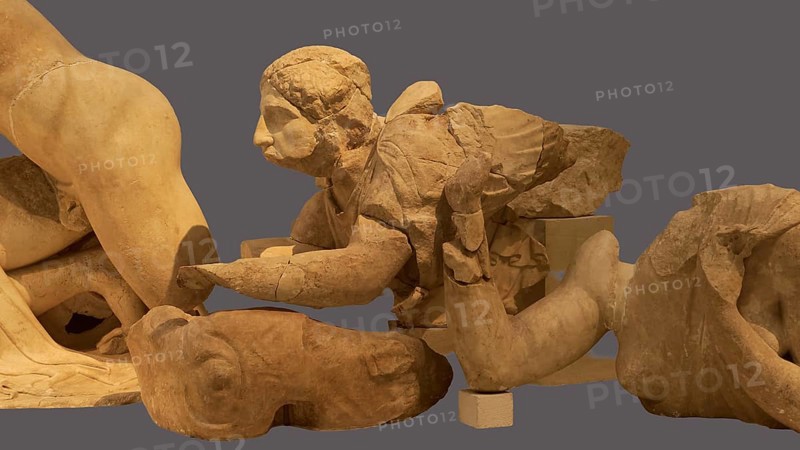 Crouching lapithin, west pediment of the Temple of Zeus, centauromachy, group of ancient stone sculptures fragmenting a historical scene, Olympia Archaeological Museum, Ancient Olympia, Olympia, Peloponnese, Greece