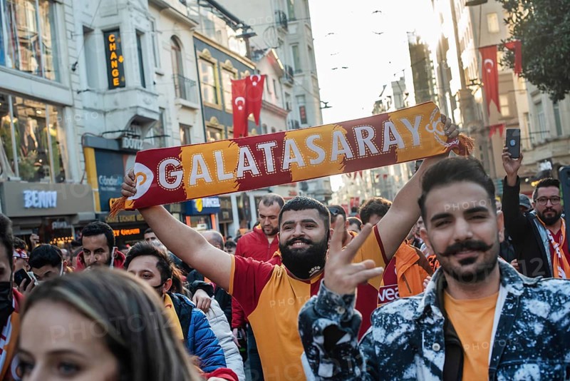 Istanbul, Turkey. November 11th 2021 A smiling Turkish Galatasary football fan holding a supporters scarf on the way to a game in Istanbul, Turkey