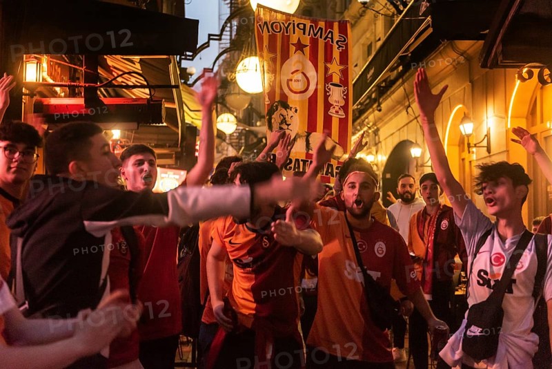 Istanbul, Turkey. October 24th 2023 Galatasaray football fans singing and chanting songs before the Champions League match against FC Bayern Munich. Nevezade near Istiklal Street, Taksim, Istanbul, Turkey