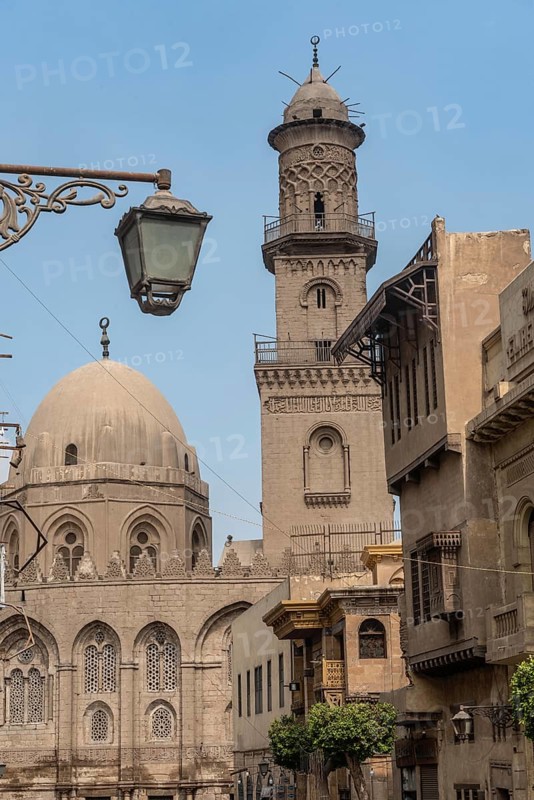 The iconic domes and minarets of the historical buildings in Islamic Cairo along Muiz street near Khan el Khalili Bazaar, Cairo, Egypt