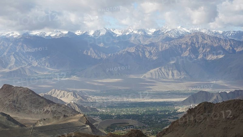 Majestic mountains with snowy peaks under a cloudy sky, Nubra Valley, trekking in Ladakh, Himalayas, India