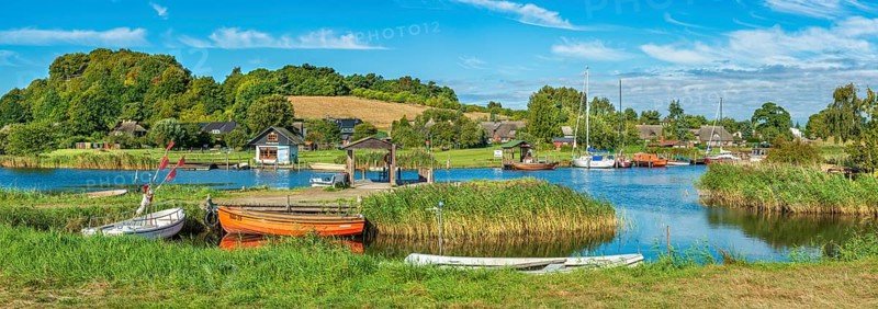 Rowing boats and sailboats in the harbor on the ferry of Moritzdorf, OT of Sellin, Mönchgut peninsula, Rügen island, Mecklenburg-Western Pomerania, Germany