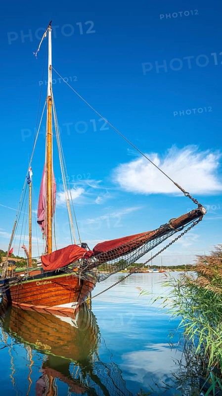 Traditional wooden sailboat in the harbor on the ferry of Moritzdorf, OT of Sellin, Mönchgut peninsula, Rügen island, Mecklenburg-Western Pomerania, Germany