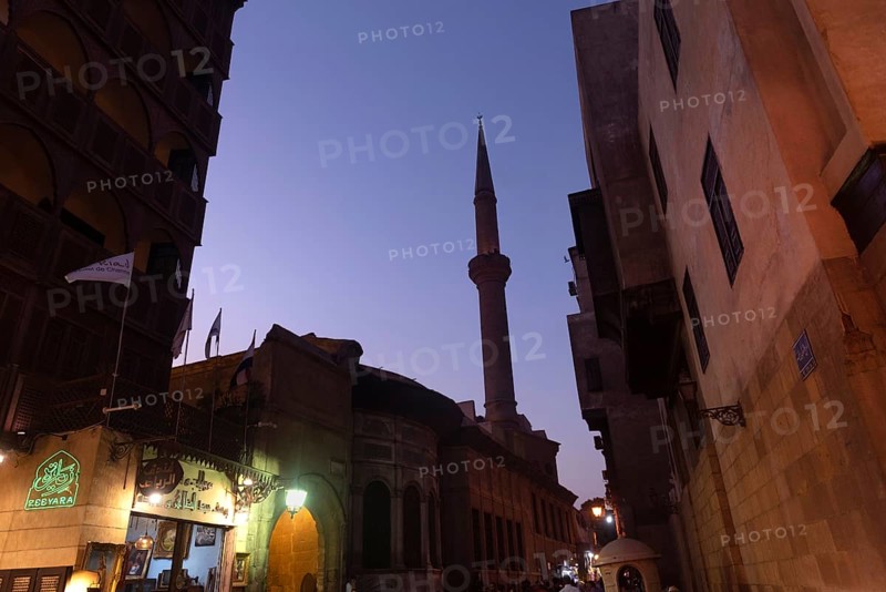 Cairo, Egypt. July 2nd 2024 The streets of Islamic Cairo at night, antique shops and mosque minarets in the Khan El Khalili Bazaar district of the ancient capital of Egypt