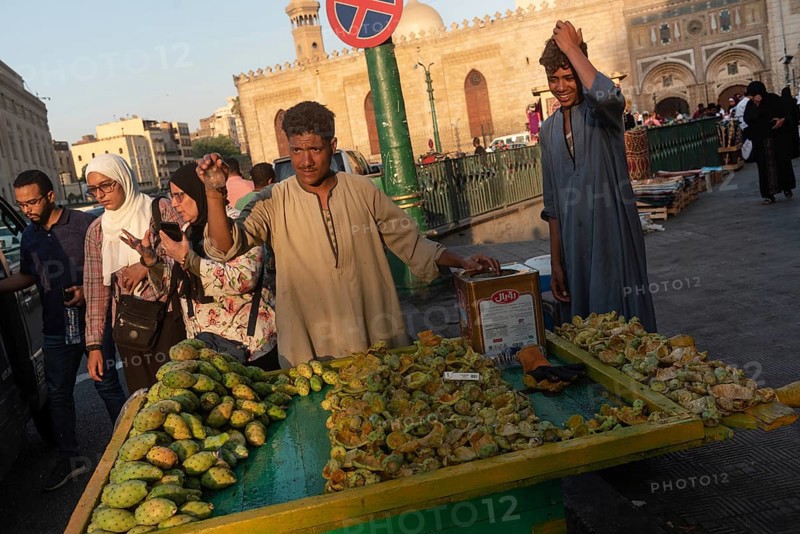 Cairo, Egypt. July 2nd 2024 A market stall holder selling prickly pear cactus fruit in the busy Islamic quarter of Cairo beside the Al Ahzar Mosque, Egypt