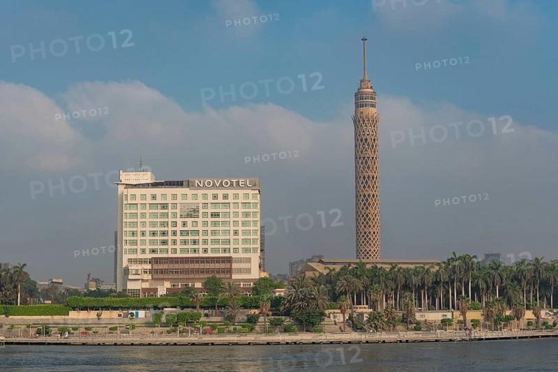 Cairo, Egypt. July 1st 2024 The Cairo Tower and Novotel in El Gezira Street, Zamalek, Cairo, beside Kasr El Nil Bridge over the River Nile, Egypt