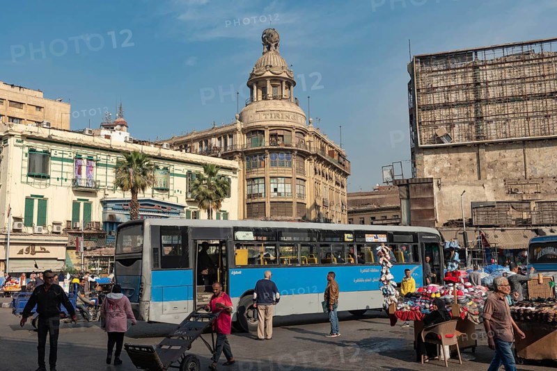 Cairo, Egypt. December 7th 2022 Busy Traffic crossing Attaba Square in front of the famous Tiring Building, an overcrowded district with a rich cultural heritage and history