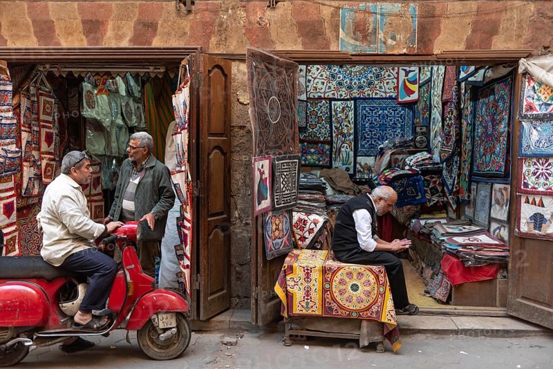 Cairo, Egypt. December 5th 2022 Shops selling Egyptian designed textiles, the Tent Makers bazaar, a Souk popular with tourists buying souvenirs nr Khan El Khalili Bazaar in Islamic Cairo, Egypt