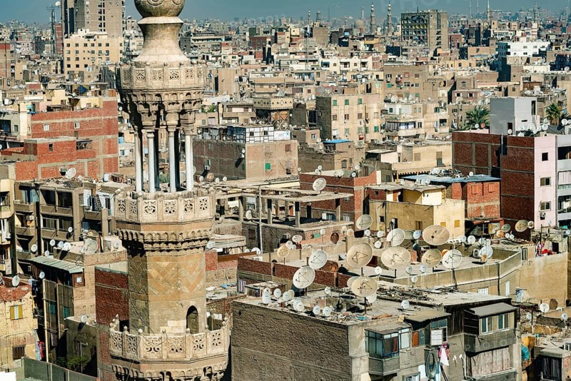 Cairo, Egypt. November 29th 2022 Mosque minaret in front of crowded aerial cityscape view of Cairo, the densely populated capital of Egypt