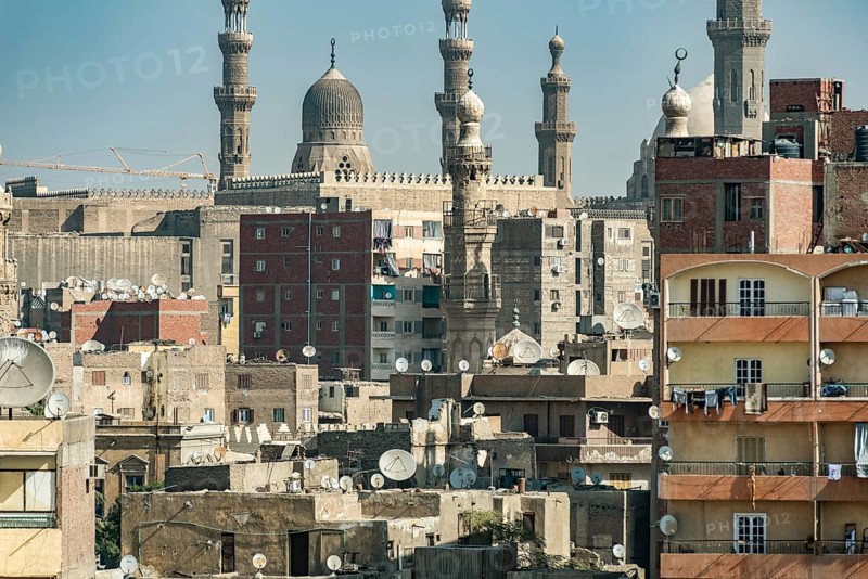 Cairo, Egypt. November 29th 2022 Aerial rooftop view of the densely populated Egyptian capital city Cairo with the Mosque minarets of Islamic Cairo in the background