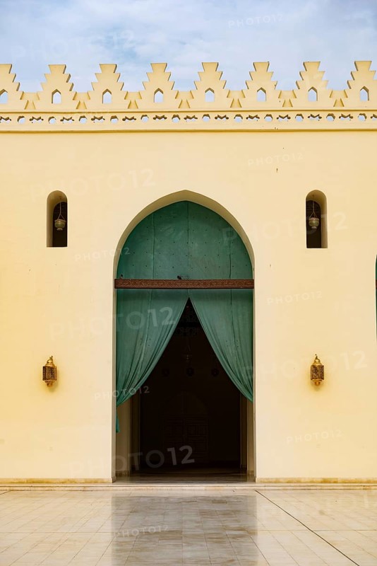 Arched doorway to the prayer hall of historic Mosque of al-Hakim, also known as Al-Anwar, named after Al-Hakim bi-Amr Allah. Just inside the Fatimid gate, Bab al-Futuh in Islamic Cairo, Egypt