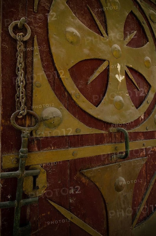 Cairo, Egypt. December 31st 2012 Egyptian Coptic Cairo, an ancient entrance door and key with Christian designs in the Old city of Egypts Christian minority
