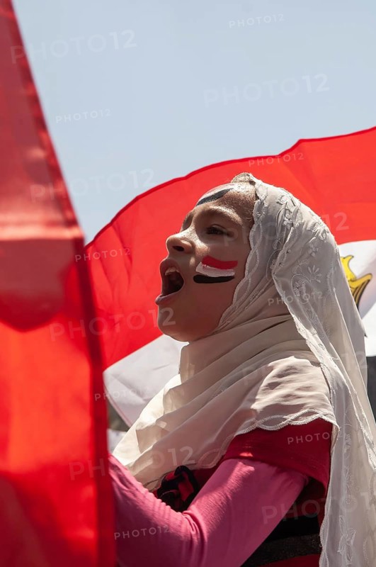 Cairo, Egypt. July 22nd 2011 Young Egyptian girl chanting slogans at an anti-government protest in Tahrir quare, Cairo Egypt