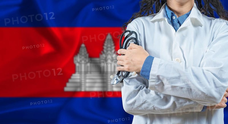 Healthcare professional with Cambodia flag background. Professional doctor holding stethoscope on Cambodia flag background