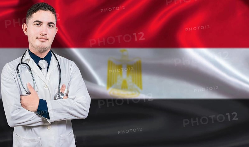 Portrait of medical professional on Egypt flag background. Egyptian national health system