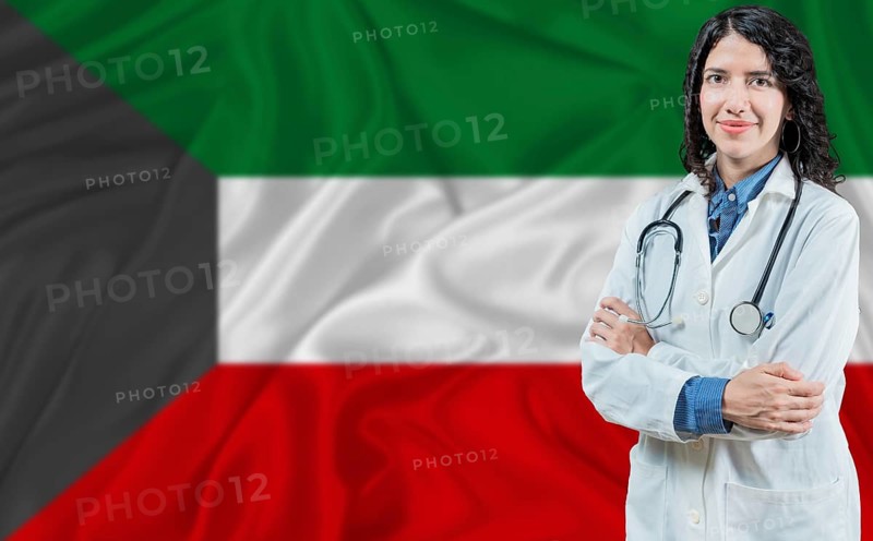 Kuwaiti medicine and healthcare concept. Doctor close up against Kuwait flag background
