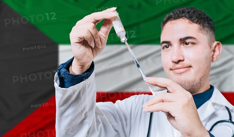 Doctor holding syringe on Kuwait flag background. Medical professional holding syringe with Kuwaiti flag in the background