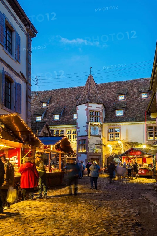 Colour-illuminated and Christmassy decorated half-timbered houses, blue hour, Christmas market, Riquewihr, Grand Est, Haut-Rhin, Alsace, France