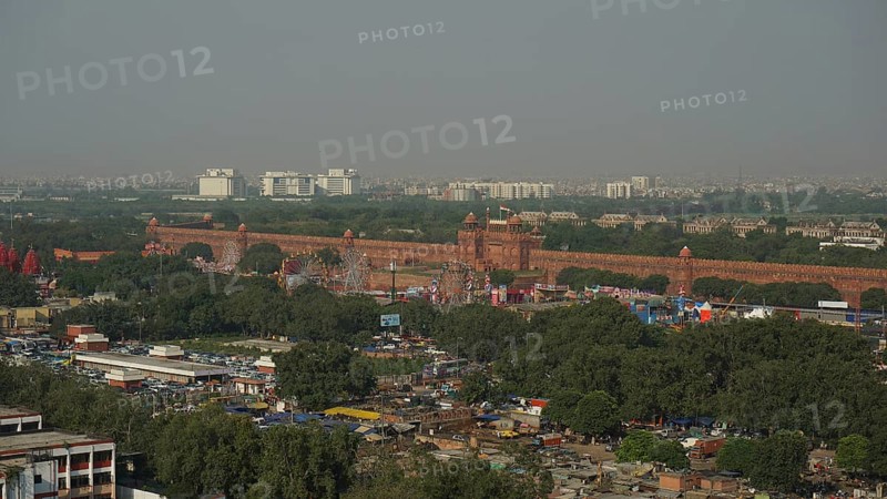 Overview of the Red Fort with surrounding trees and urban views, Delhi, India