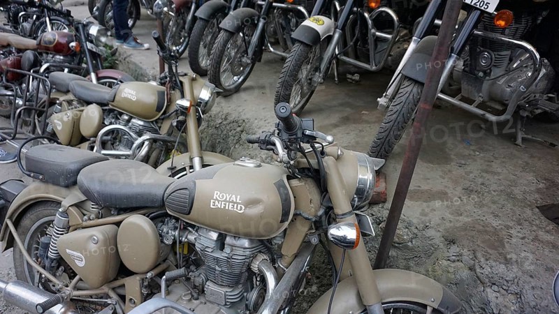 Various Royal Enfield motorcycles parked at a dealer, Manali, Himachal Pradesh, India