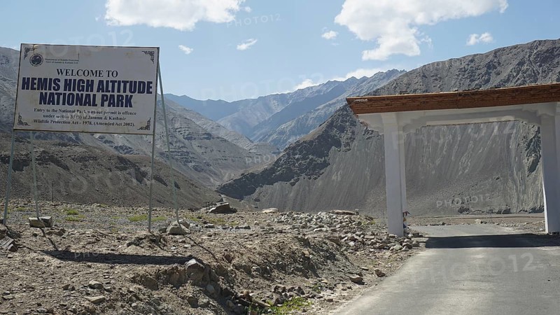 Entrance gate to Hemis National Park with sign and mountainous surroundings, Ladakh, Himalayas, India
