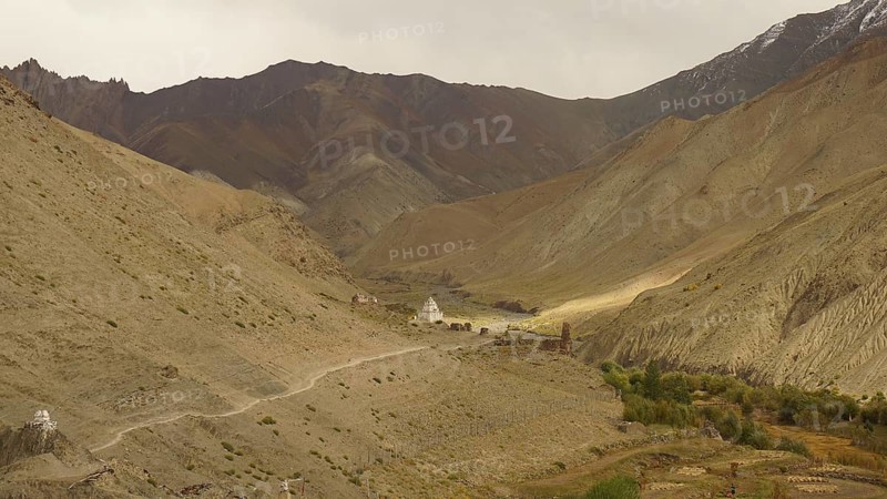 Wide valley with a trail in the midst of a majestic mountainous landscape, trekking in Ladakh, Himalayas, India